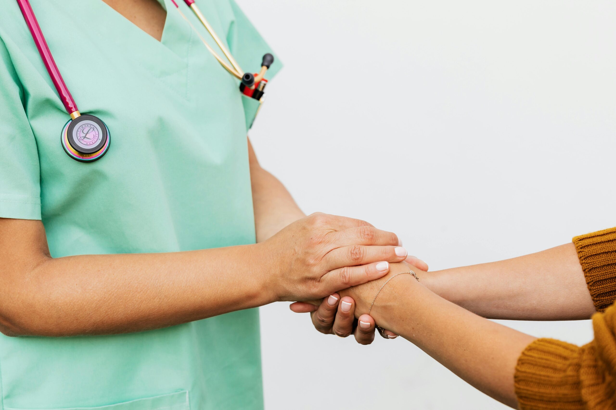 A doctor holding a patients hands at North Star Treatment.